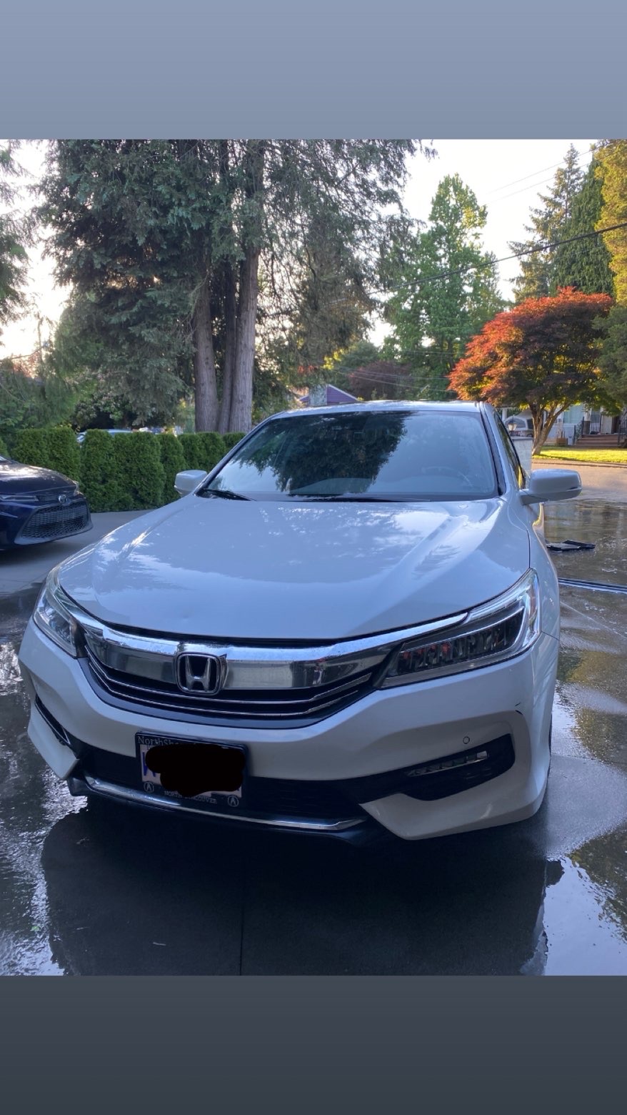 White Honda Accord after a full wash